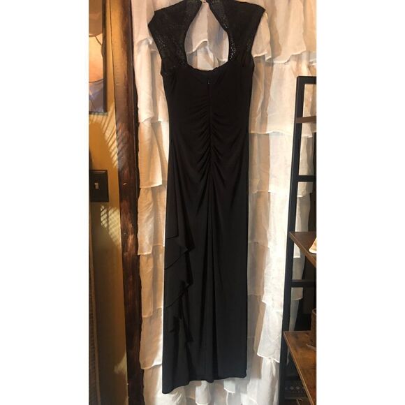 Turn heads with this R & M Richards black cap sleeve beaded gown.Retail $149.00 - Picture 5 of 16